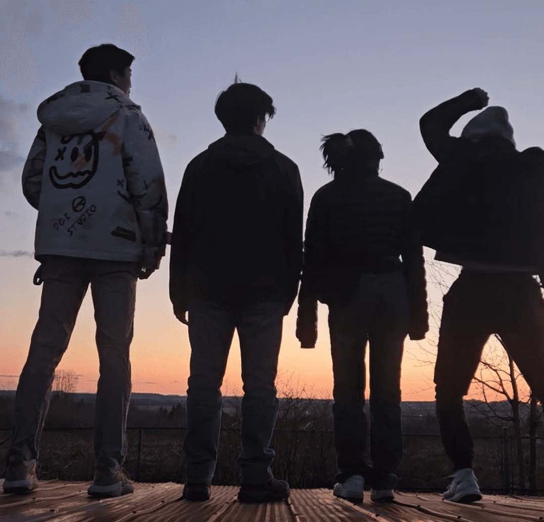 Peter Zhang with friends at sunset